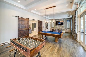 A Pool Table in The Middle of a Room at The Aster Apartments, Cary, North Carolina